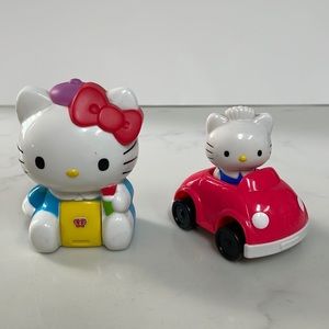 Vintage Hello Kitty sticker dispenser and car that has a stamp